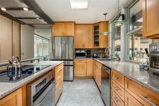 2010 NW 32nd Ter, Gainesville, FL 32605 - kitchen featuring ventilation hood, stainless steel appliances, light stone countertops, glass insert cabinets, and light tile patterned flooring