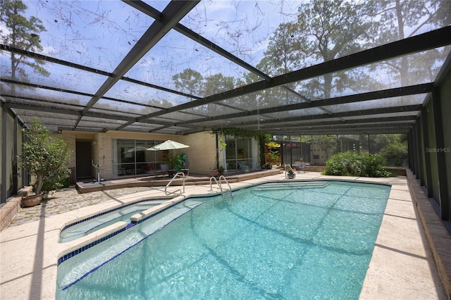 2010 NW 32nd Ter, Gainesville, FL 32605 - view of pool with a patio area, a lanai, and a pool with connected hot tub