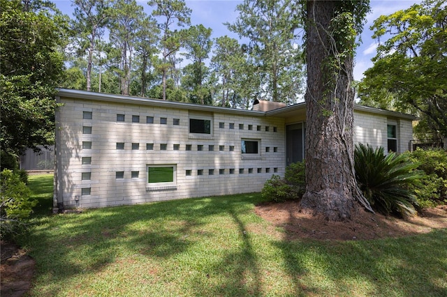2010 NW 32nd Ter, Gainesville, FL 32605 - view of home's exterior featuring a yard