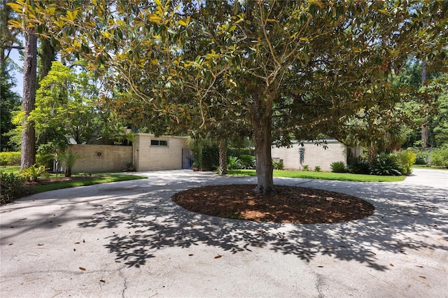 2010 NW 32nd Ter, Gainesville, FL 32605 - view of front facade with curved driveway and brick siding
