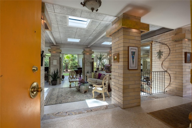 2010 NW 32nd Ter, Gainesville, FL 32605 - foyer entrance with decorative columns and speckled floor
