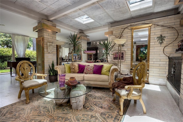 2010 NW 32nd Ter, Gainesville, FL 32605 - living area with decorative columns and a skylight