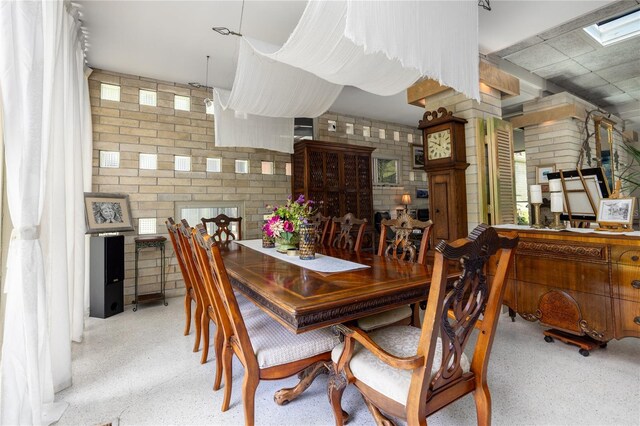 2010 NW 32nd Ter, Gainesville, FL 32605 - dining room with brick wall