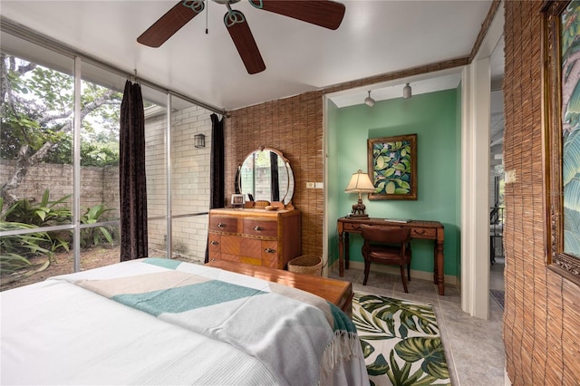 2010 NW 32nd Ter, Gainesville, FL 32605 - bedroom with brick wall and a ceiling fan