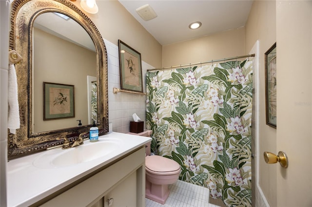 2010 NW 32nd Ter, Gainesville, FL 32605 - bathroom with tile patterned flooring, vanity, tile walls, a shower with shower curtain, and recessed lighting
