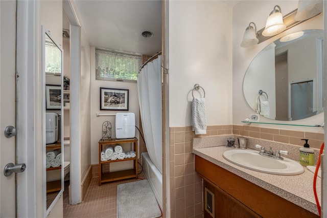 2010 NW 32nd Ter, Gainesville, FL 32605 - bathroom with vanity, shower / bath combo with shower curtain, and tile patterned floors