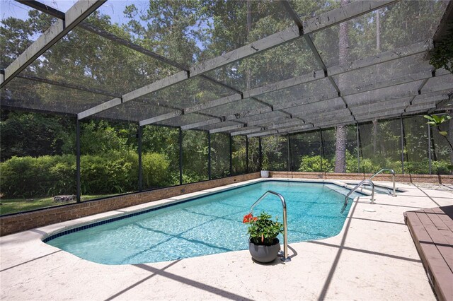 2010 NW 32nd Ter, Gainesville, FL 32605 - outdoor pool with a patio and glass enclosure