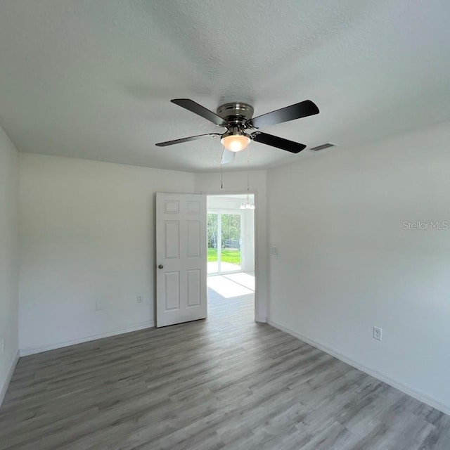 15433 SW 47th Avenue Rd, Ocala, FL 34473 - unfurnished room featuring wood finished floors, ceiling fan, and a textured ceiling