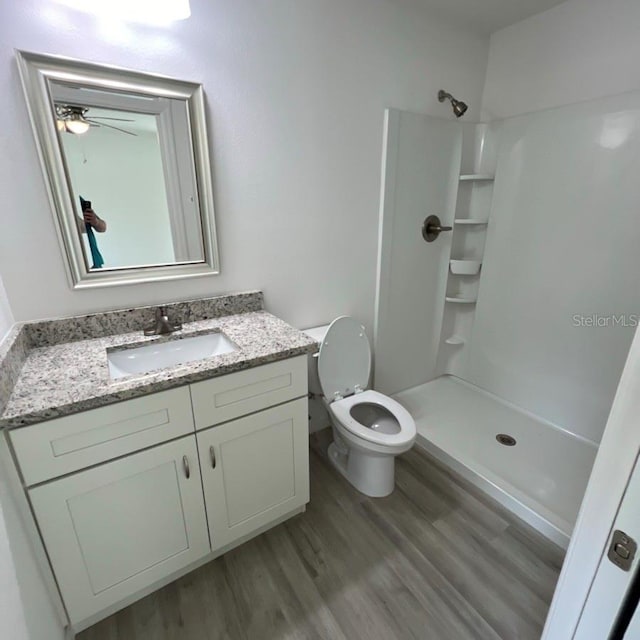 15433 SW 47th Avenue Rd, Ocala, FL 34473 - bathroom featuring vanity, a shower, and wood finished floors