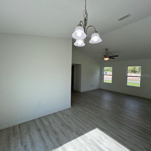 15433 SW 47th Avenue Rd, Ocala, FL 34473 - unfurnished room featuring lofted ceiling, a chandelier, wood finished floors, and a ceiling fan