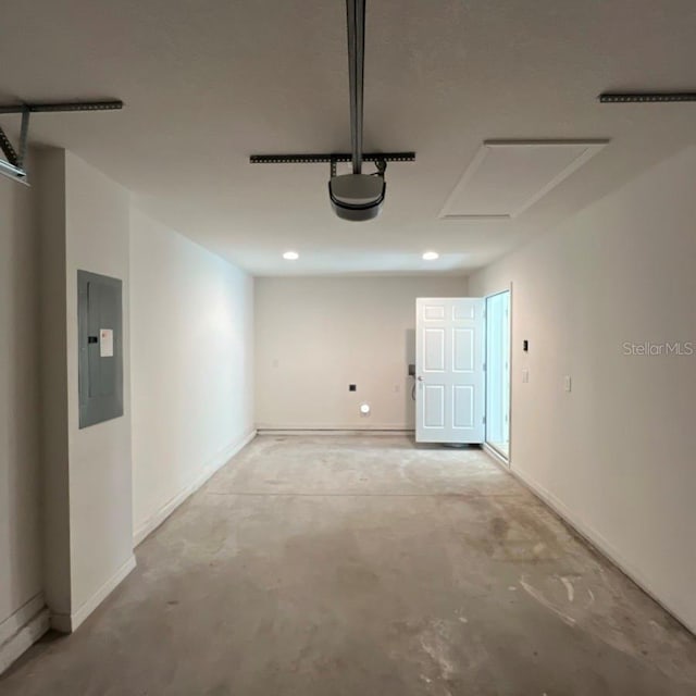 15433 SW 47th Avenue Rd, Ocala, FL 34473 - garage featuring electric panel, a garage door opener, and recessed lighting