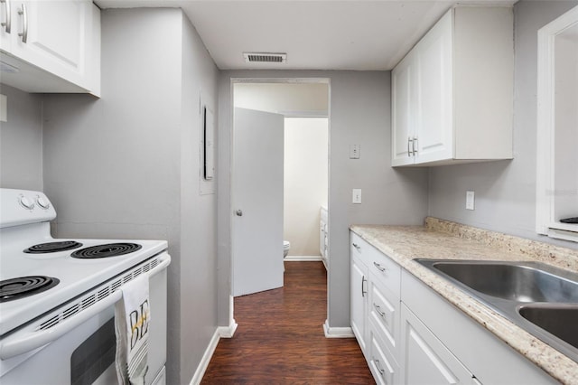 4325 NW 41st Pl Unit 6, Gainesville, FL 32606 - kitchen featuring electric range, dark wood-style flooring, white cabinetry, and light countertops