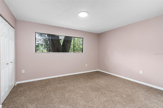 4325 NW 41st Pl Unit 6, Gainesville, FL 32606 - unfurnished bedroom with carpet and a closet
