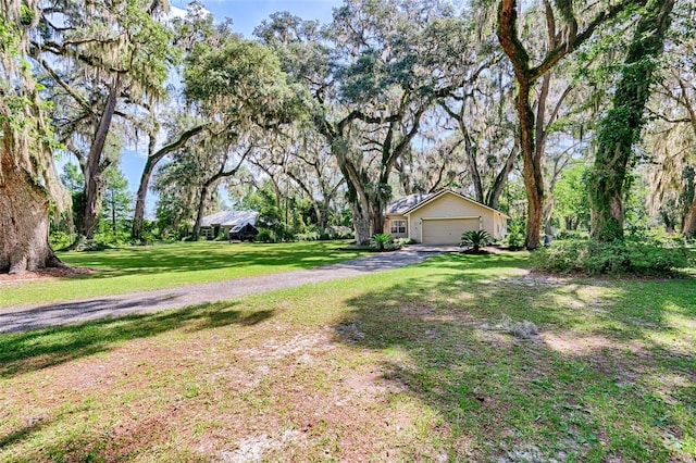 6505 SW 135th Pl, Archer, FL 32618 - view of grassy yard featuring a garage