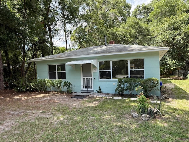 926 NW 24th Ave, Gainesville, FL 32609 - view of front facade with a front lawn and a chimney