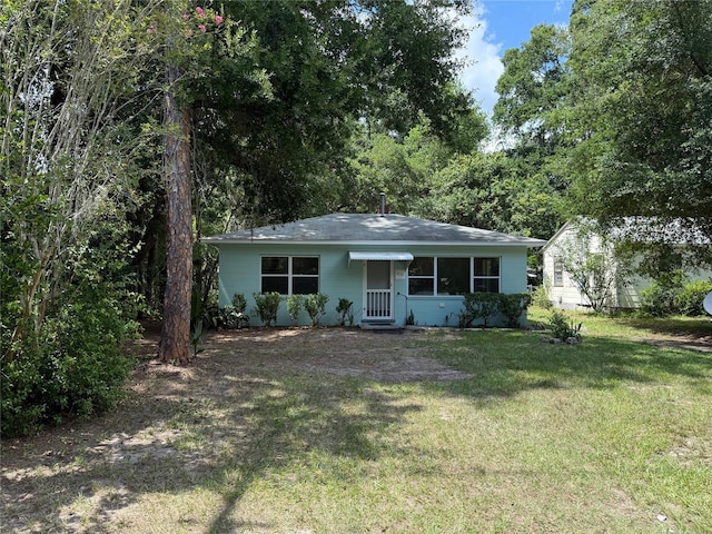 926 NW 24th Ave, Gainesville, FL 32609 - view of front of home with a front lawn