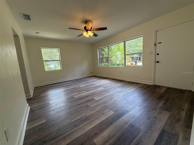926 NW 24th Ave, Gainesville, FL 32609 - unfurnished room with plenty of natural light, dark wood-style flooring, and ceiling fan