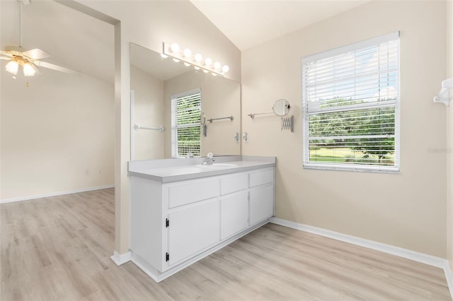 3846 NW 62nd Pl, Gainesville, FL 32653 - bathroom with lofted ceiling, wood finished floors, vanity, and ceiling fan