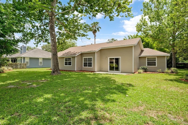 3846 NW 62nd Pl, Gainesville, FL 32653 - back of property featuring a yard and a shingled roof