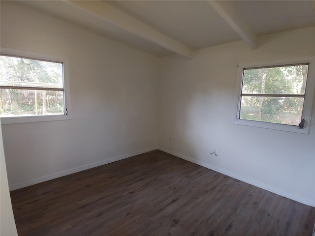 2904 NE 11th Ter, Gainesville, FL 32609 - spare room featuring beam ceiling and dark wood finished floors