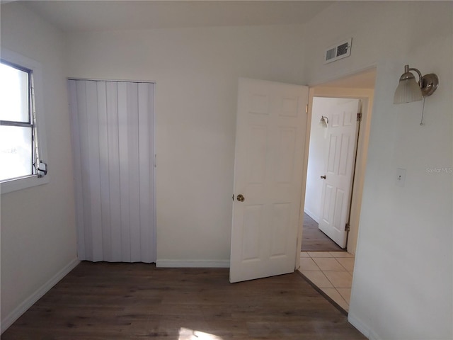 2904 NE 11th Ter, Gainesville, FL 32609 - unfurnished room with wood finished floors and baseboards