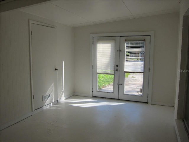 2904 NE 11th Ter, Gainesville, FL 32609 - unfurnished room featuring french doors and concrete flooring