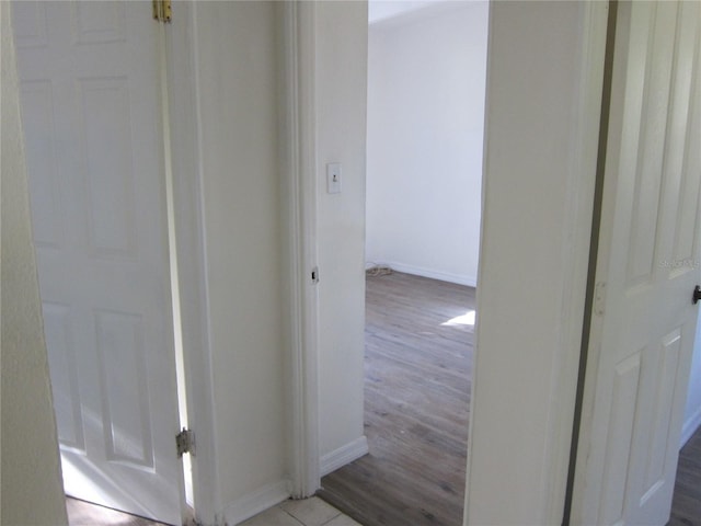 2904 NE 11th Ter, Gainesville, FL 32609 - hallway featuring baseboards and wood finished floors