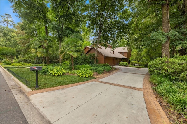 1225 NW 23rd Ter, Gainesville, FL 32605 - view of front of house featuring concrete driveway and a garage