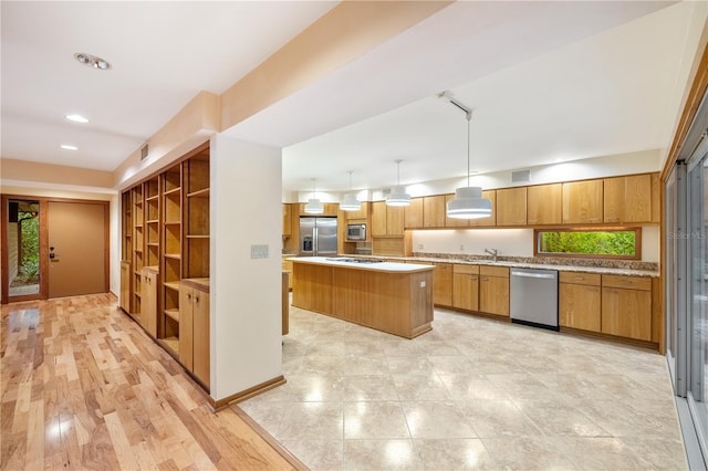 1225 NW 23rd Ter, Gainesville, FL 32605 - kitchen with stainless steel appliances, a kitchen island, light countertops, brown cabinets, and pendant lighting