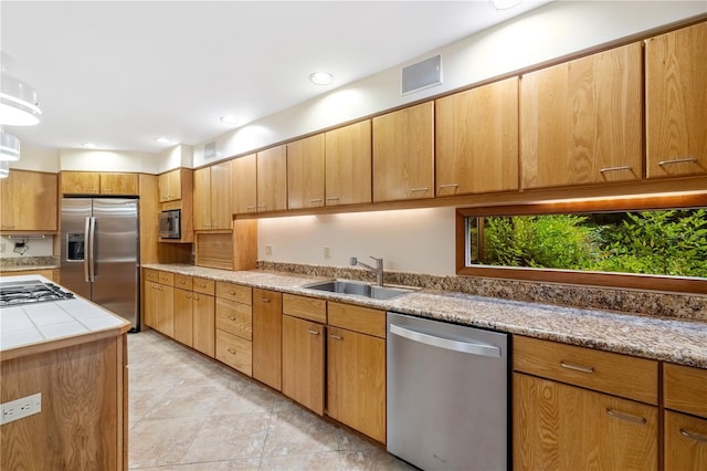 1225 NW 23rd Ter, Gainesville, FL 32605 - kitchen with appliances with stainless steel finishes and tile counters