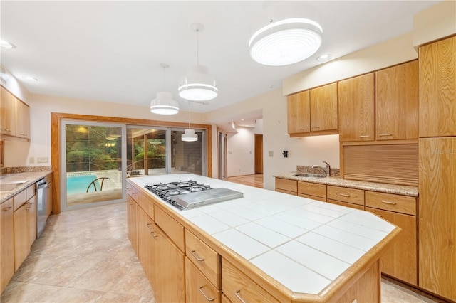 1225 NW 23rd Ter, Gainesville, FL 32605 - kitchen with appliances with stainless steel finishes, a center island, tile counters, decorative light fixtures, and recessed lighting