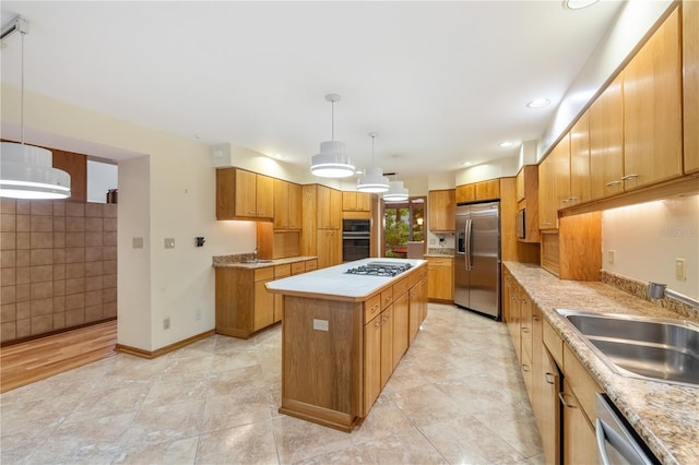 1225 NW 23rd Ter, Gainesville, FL 32605 - kitchen with stainless steel appliances, a kitchen island, light countertops, pendant lighting, and recessed lighting