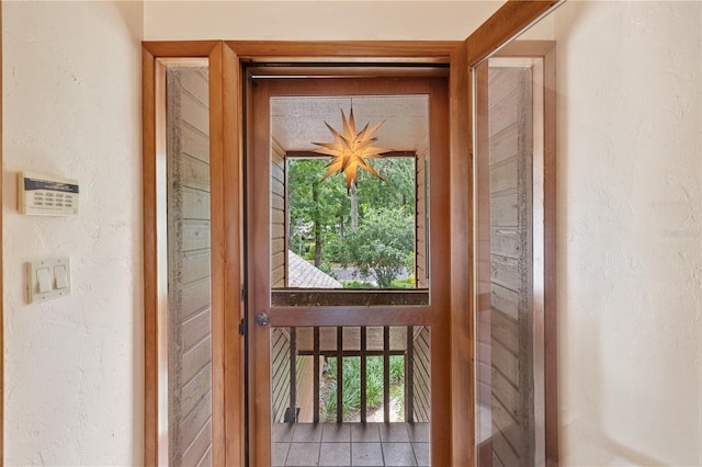 1225 NW 23rd Ter, Gainesville, FL 32605 - doorway to outside with a textured wall