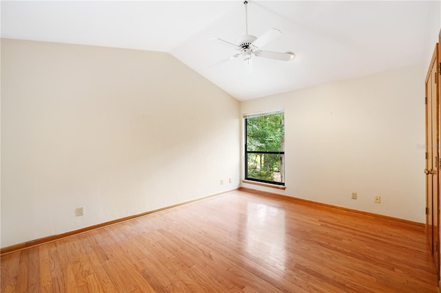 1225 NW 23rd Ter, Gainesville, FL 32605 - empty room featuring ceiling fan, light wood-style flooring, and vaulted ceiling