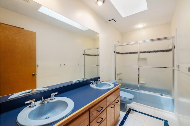 1225 NW 23rd Ter, Gainesville, FL 32605 - bathroom with a skylight, tile patterned floors, combined bath / shower with glass door, and double vanity