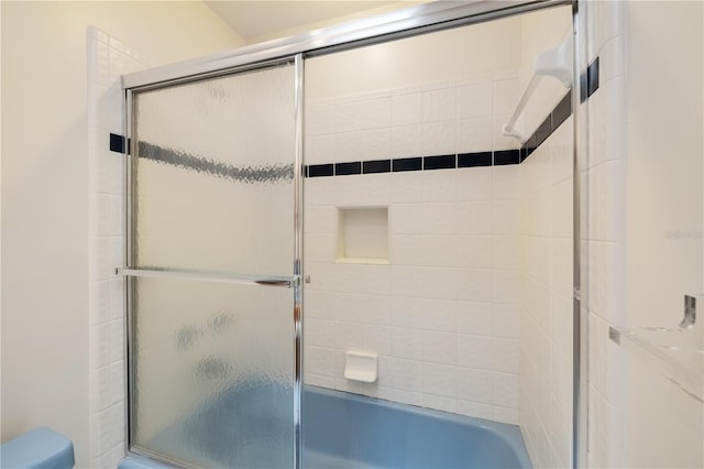 1225 NW 23rd Ter, Gainesville, FL 32605 - bathroom featuring toilet and combined bath / shower with glass door