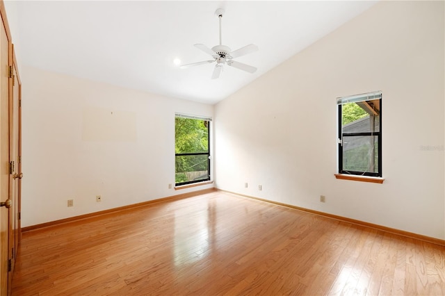 1225 NW 23rd Ter, Gainesville, FL 32605 - unfurnished room with healthy amount of natural light, vaulted ceiling, light wood-style flooring, and a ceiling fan