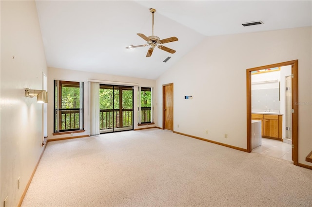 1225 NW 23rd Ter, Gainesville, FL 32605 - unfurnished room with a ceiling fan, light carpet, and high vaulted ceiling