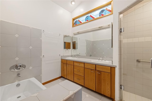 1225 NW 23rd Ter, Gainesville, FL 32605 - bathroom with double vanity, vaulted ceiling, and tile patterned floors