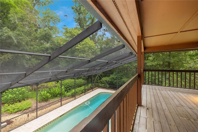 1225 NW 23rd Ter, Gainesville, FL 32605 - wooden terrace featuring an outdoor pool and glass enclosure