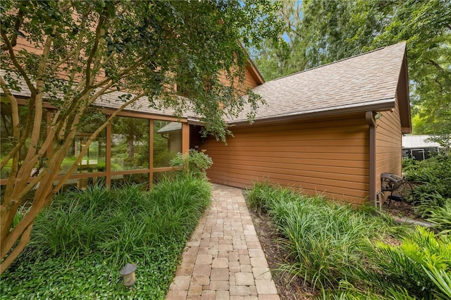 1225 NW 23rd Ter, Gainesville, FL 32605 - view of side of property featuring a shingled roof