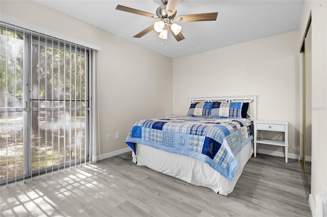 1700 SW 16th Ct Unit E9, Gainesville, FL 32608 - bedroom featuring wood finished floors and a ceiling fan