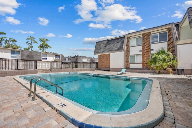 1700 SW 16th Ct Unit E9, Gainesville, FL 32608 - community pool featuring a patio