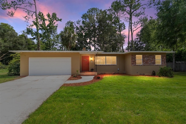 3857 SW 4th Pl, Gainesville, FL 32607 - view of front of home featuring driveway, an attached garage, and stucco siding