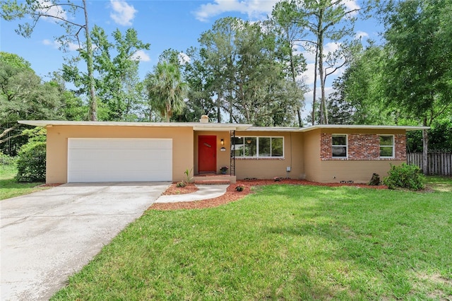 3857 SW 4th Pl, Gainesville, FL 32607 - view of front of property with concrete driveway, an attached garage, and brick siding