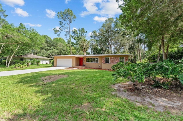 3857 SW 4th Pl, Gainesville, FL 32607 - ranch-style house with concrete driveway, an attached garage, and a front lawn