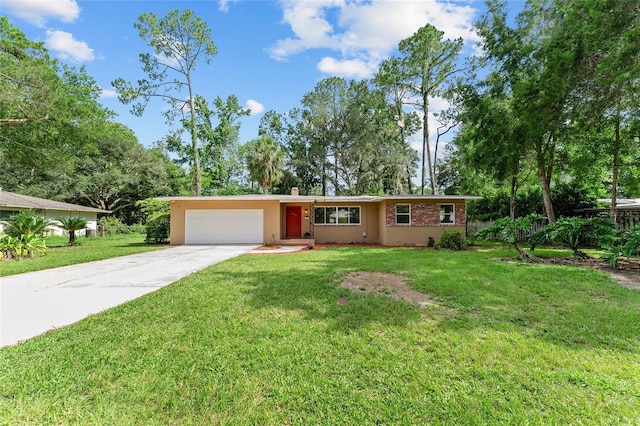3857 SW 4th Pl, Gainesville, FL 32607 - ranch-style home featuring driveway, an attached garage, and a front lawn