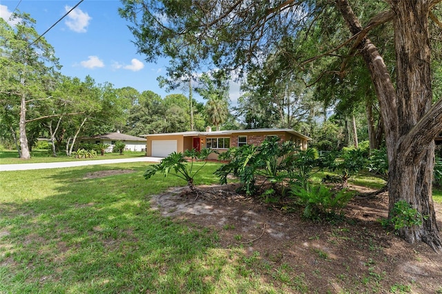 3857 SW 4th Pl, Gainesville, FL 32607 - ranch-style house with an attached garage, concrete driveway, and a front yard