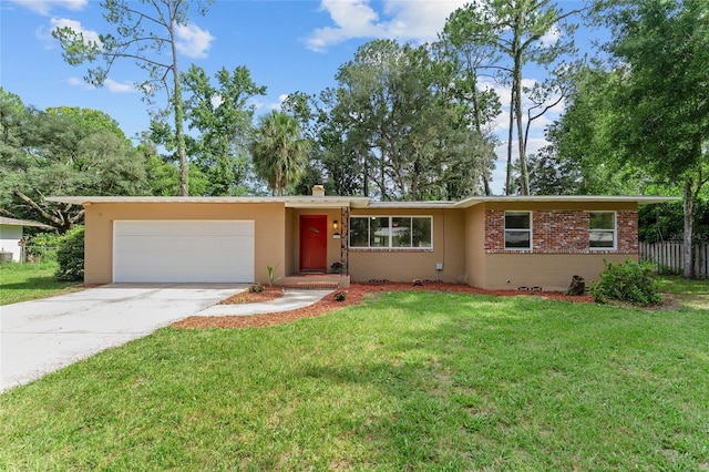 3857 SW 4th Pl, Gainesville, FL 32607 - single story home featuring a garage, driveway, and brick siding