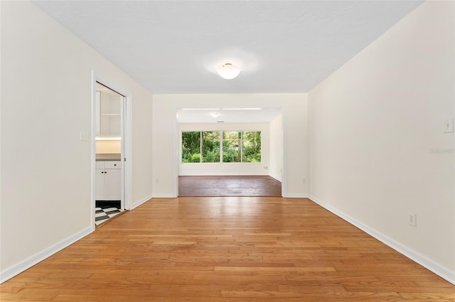 3857 SW 4th Pl, Gainesville, FL 32607 - unfurnished room featuring light wood-style floors and baseboards